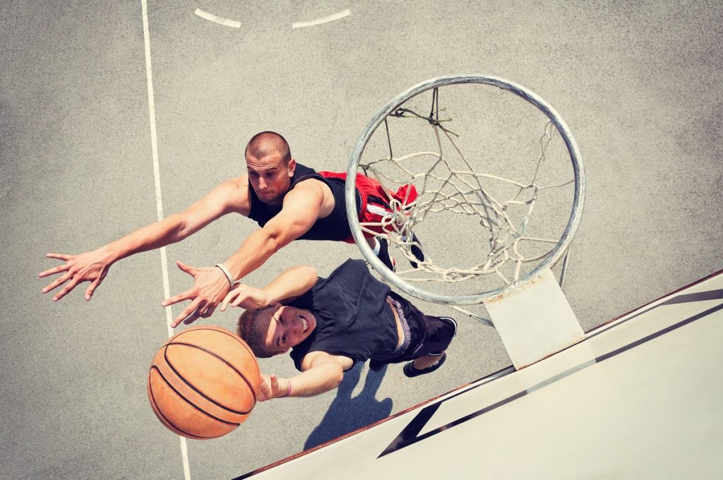 Men playing basketball one-on-one